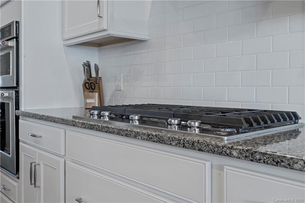 5318 Meadowcroft Way Fort Mill, SC 29708 - Photo 13 of 48 a close view of a stove a sink and dishwasher in a kitchen