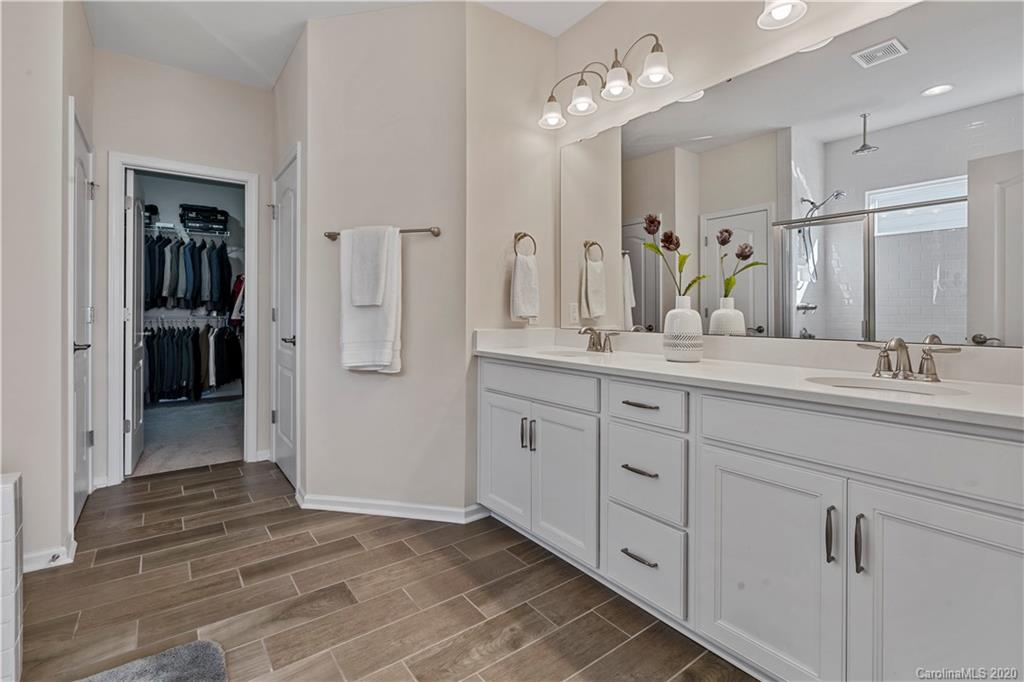 5318 Meadowcroft Way Fort Mill, SC 29708 - Photo 20 of 48 a spacious bathroom with a double vanity sink shower and a mirror