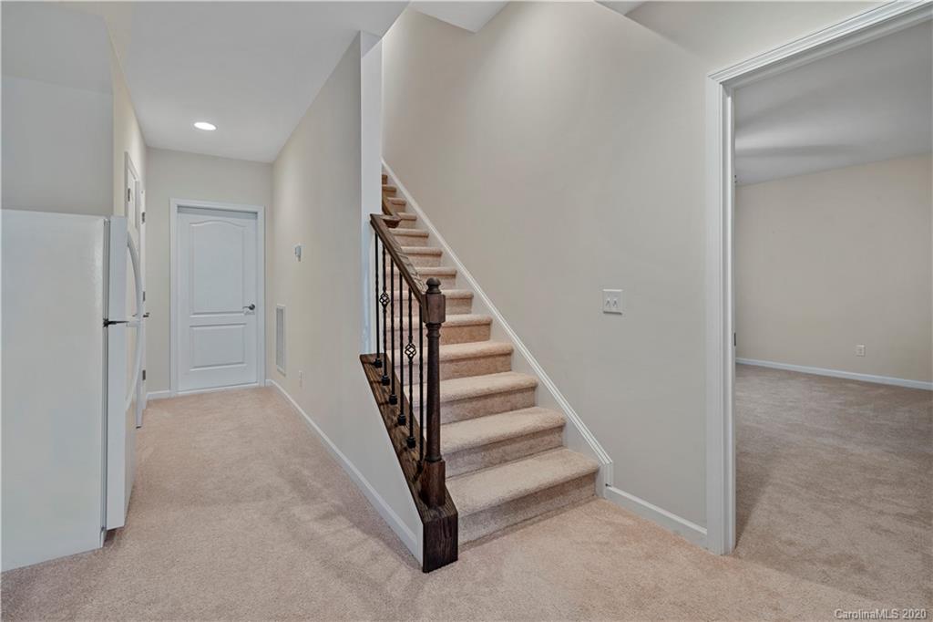 5318 Meadowcroft Way Fort Mill, SC 29708 - Photo 30 of 48 a view of a hallway with staircase