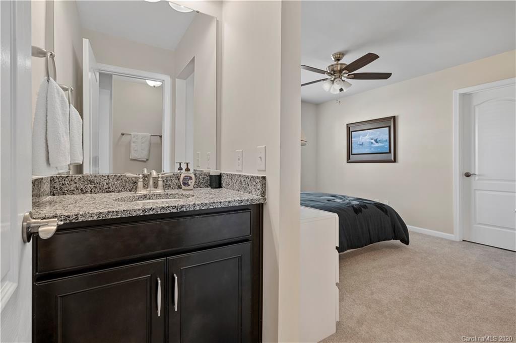 5318 Meadowcroft Way Fort Mill, SC 29708 - Photo 34 of 48 a en suite bathroom with a granite countertop sink and a mirror