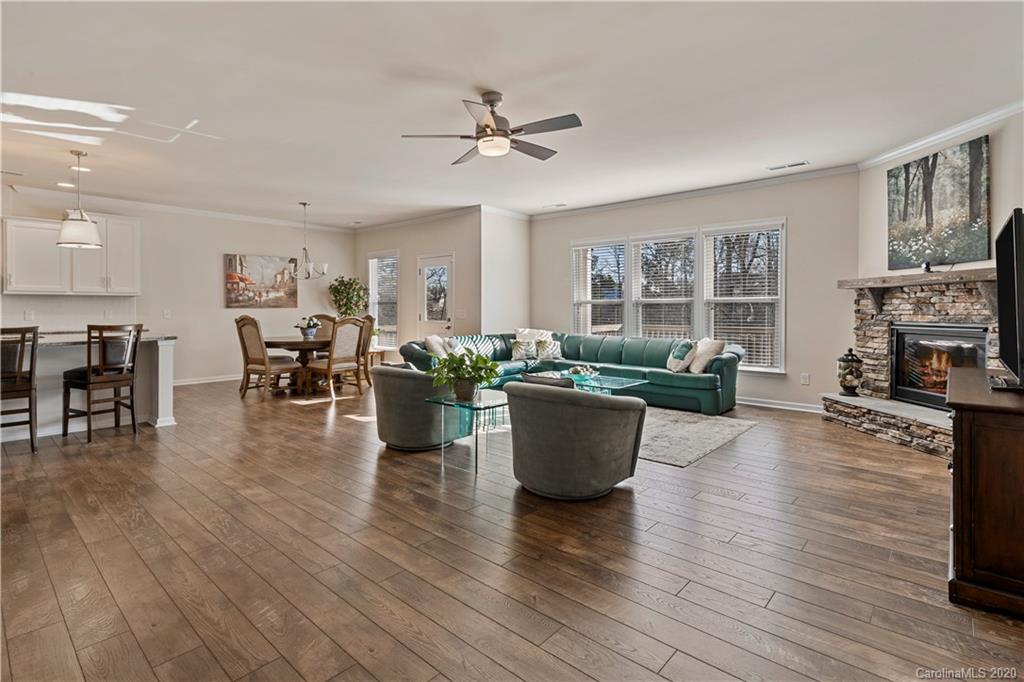 5318 Meadowcroft Way Fort Mill, SC 29708 - Photo 7 of 48 a living room with furniture a window and kitchen view