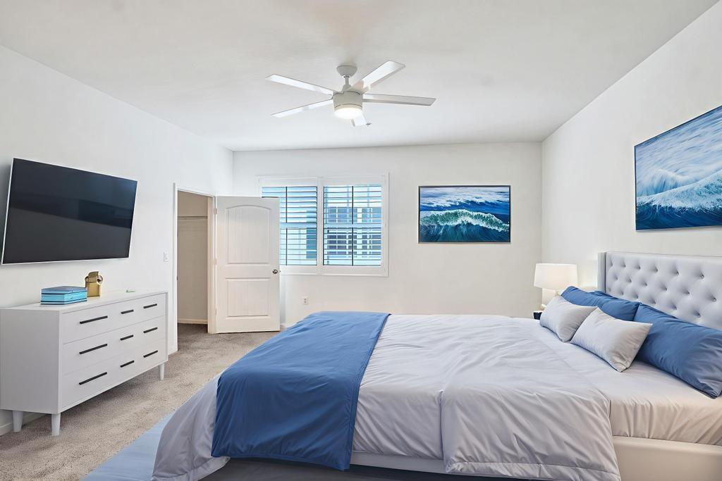 608 Southwest 3rd Avenue Pompano Beach, FL 33060 - Photo 19 of 64 a bedroom with a large bed and a flat screen tv