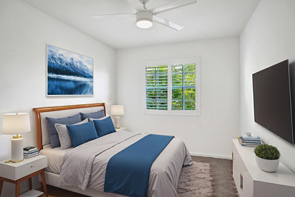 608 Southwest 3rd Avenue Pompano Beach, FL 33060 - Photo 30 of 64 a bedroom with a bed a television and a window