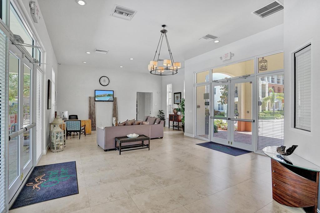 608 Southwest 3rd Avenue Pompano Beach, FL 33060 - Photo 41 of 64 a living room with furniture and a chandelier