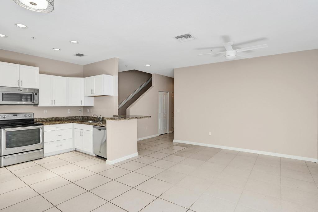 608 Southwest 3rd Avenue Pompano Beach, FL 33060 - Photo 10 of 64 a kitchen with a sink cabinets and stainless steel appliances