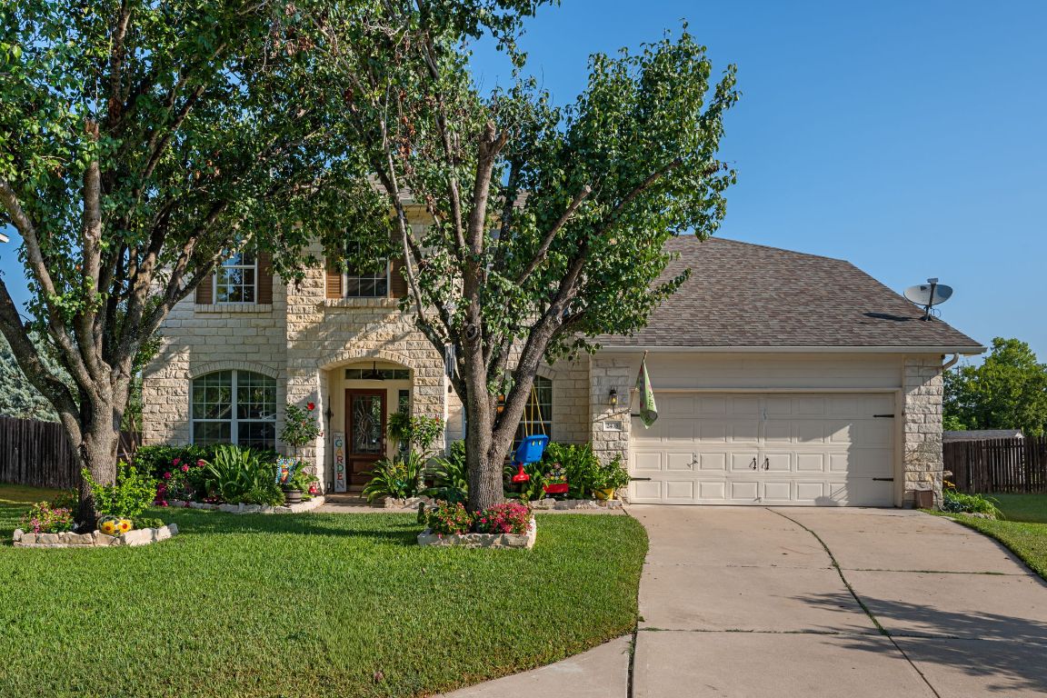 2435 Candle Ridge Trail Georgetown, TX 78626 - Photo 1 of 1 a front view of a house with garden