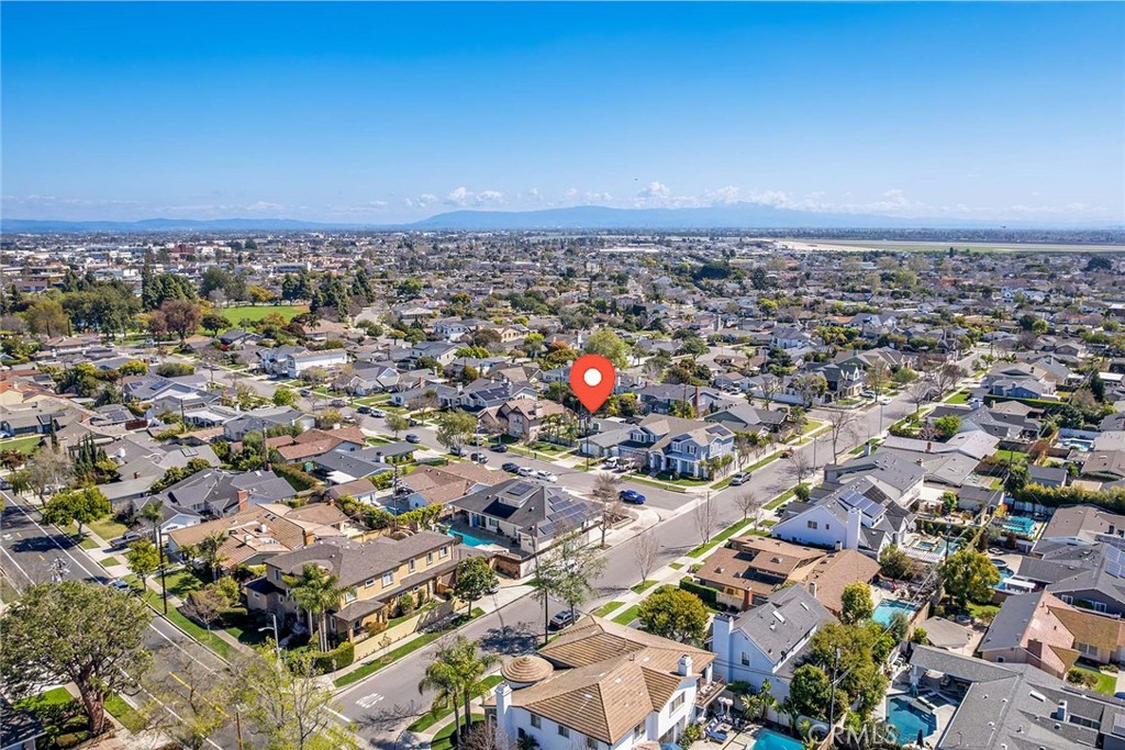 11402 Donovan Road Los Alamitos, CA 90720 - Photo 42 of 44 an aerial view of a city with lots of residential buildings and mountain view in back