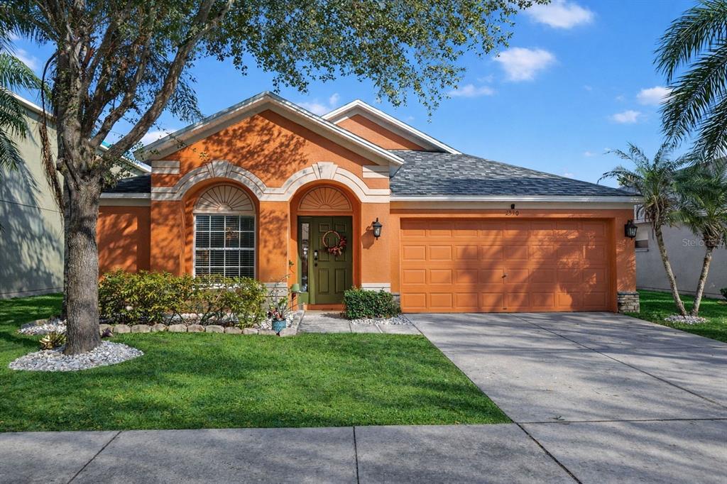 2310 Potomac Mark Place Ruskin, FL 33570 - Photo 1 of 40 a front view of a house with garden