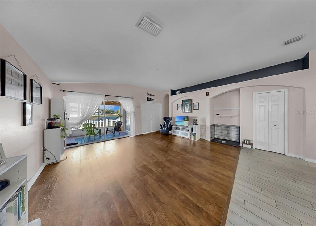2310 Potomac Mark Place Ruskin, FL 33570 - Photo 14 of 40 a view of empty room with wooden floor and furniture
