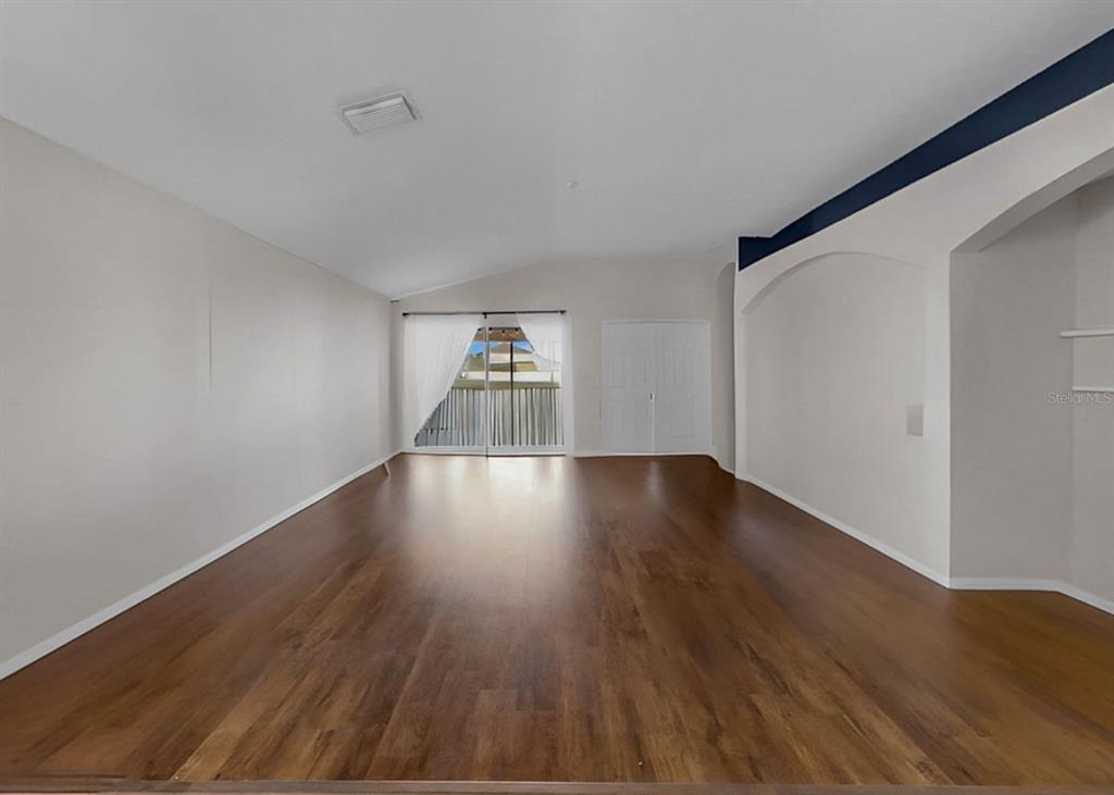 2310 Potomac Mark Place Ruskin, FL 33570 - Photo 15 of 40 a view of room with wooden floor and window