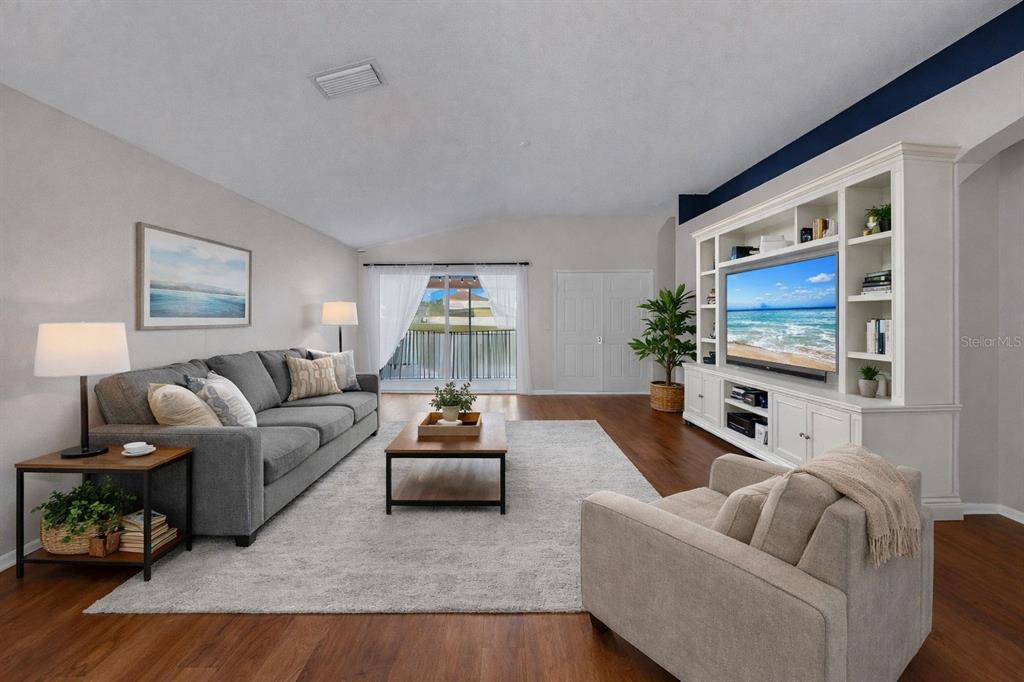 2310 Potomac Mark Place Ruskin, FL 33570 - Photo 16 of 40 a living room with furniture and a flat screen tv