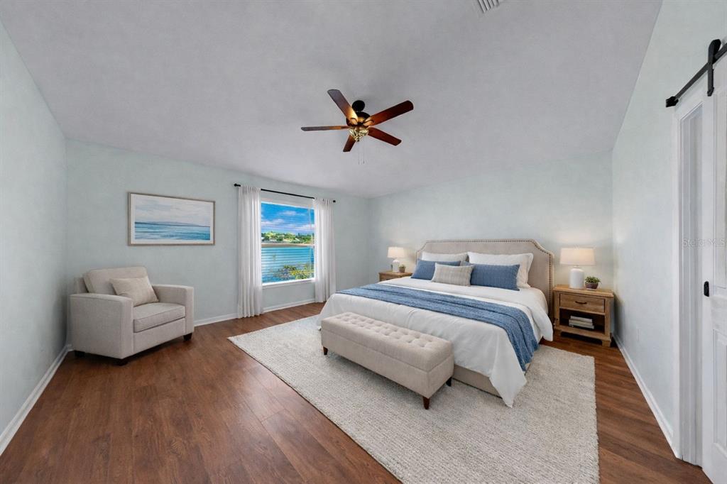 2310 Potomac Mark Place Ruskin, FL 33570 - Photo 19 of 40 a bedroom with bed couch and a window