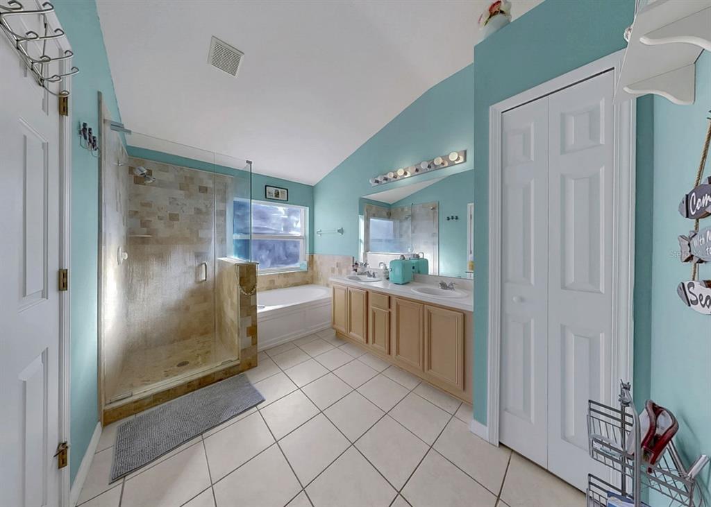 2310 Potomac Mark Place Ruskin, FL 33570 - Photo 21 of 40 a large bathroom with a glass shower door and a sink