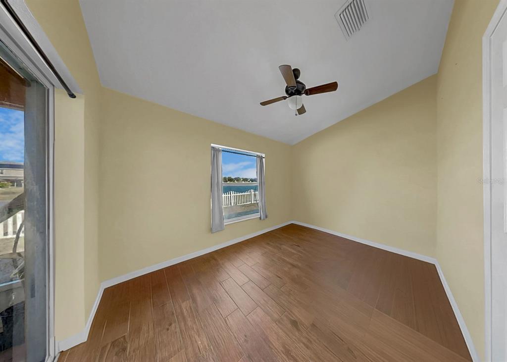 2310 Potomac Mark Place Ruskin, FL 33570 - Photo 24 of 40 a view of room with hardwood floor and ceiling fan