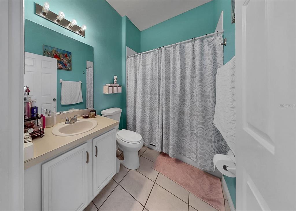 2310 Potomac Mark Place Ruskin, FL 33570 - Photo 26 of 40 a bathroom with a sink a toilet and shower