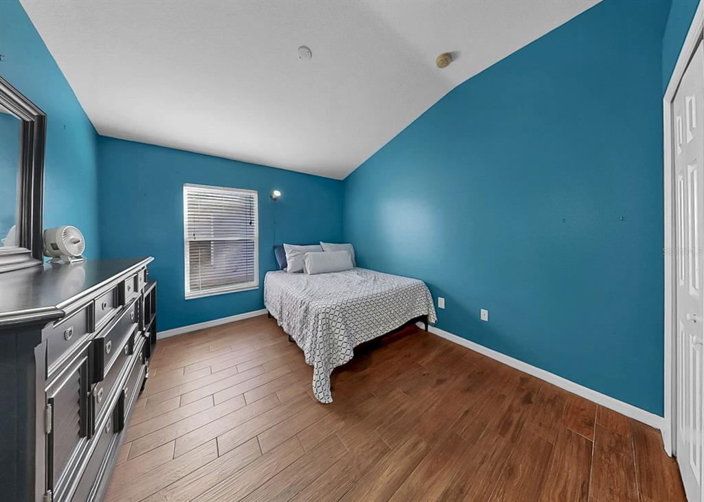 2310 Potomac Mark Place Ruskin, FL 33570 - Photo 27 of 40 a bedroom with a bed and a dresser