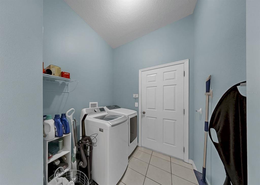 2310 Potomac Mark Place Ruskin, FL 33570 - Photo 28 of 40 a utility room with cabinets washer and dryer