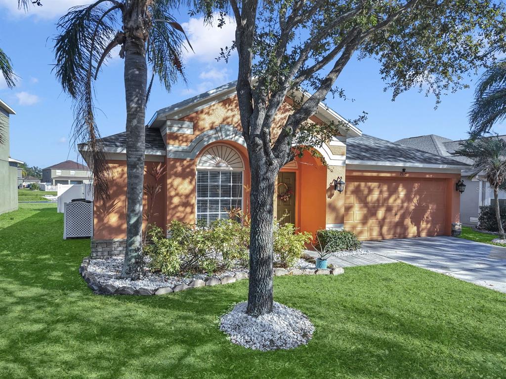 2310 Potomac Mark Place Ruskin, FL 33570 - Photo 39 of 40 a front view of a house with garden