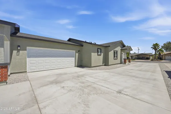 a view of garage and yard