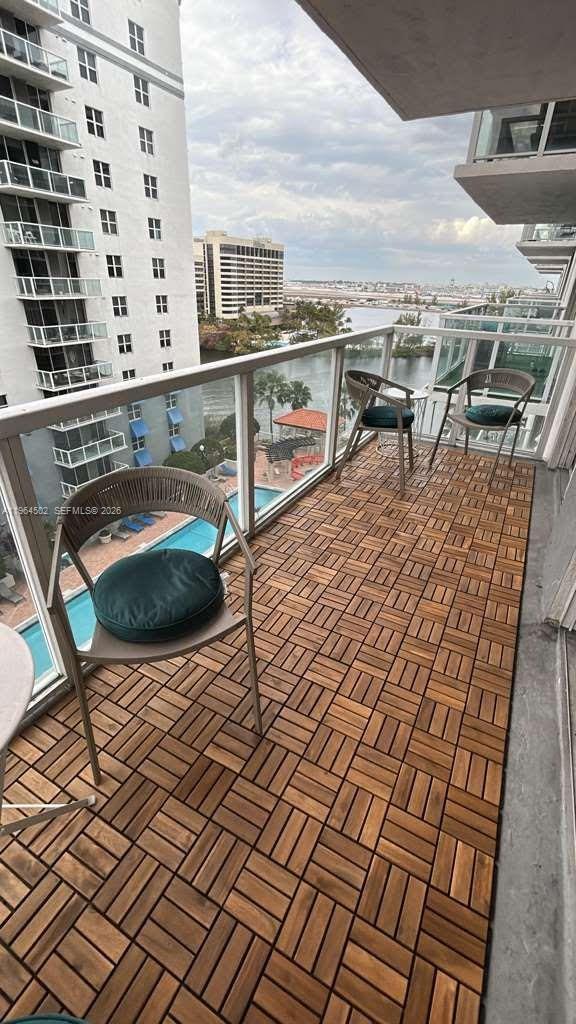 5077 Northwest 7th Street, Unit 1012 Miami, FL 33126 - Photo 12 of 15 a view of roof deck with outdoor seating and city view
