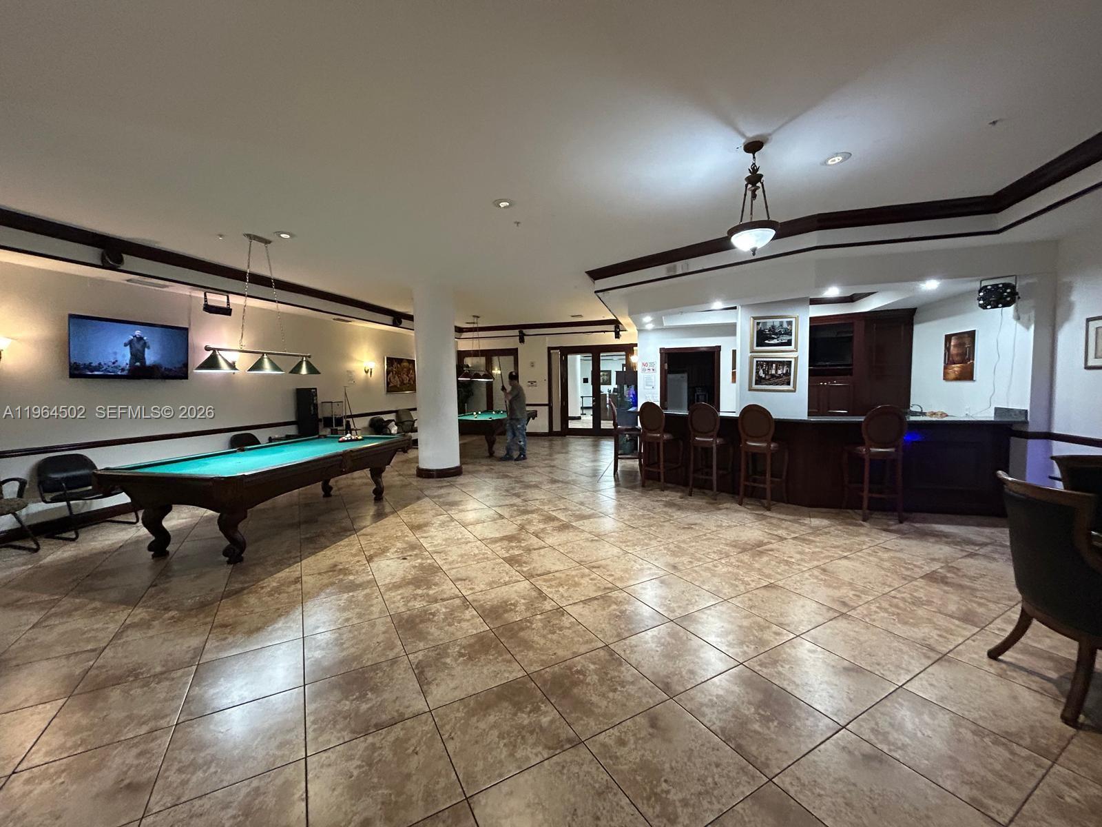 5077 Northwest 7th Street, Unit 1012 Miami, FL 33126 - Photo 14 of 15 a lobby with furniture and window