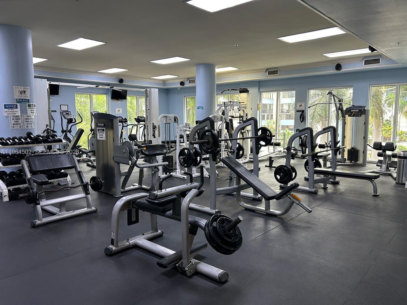 5077 Northwest 7th Street, Unit 1012 Miami, FL 33126 - Photo 15 of 15 a view of a room with gym equipment