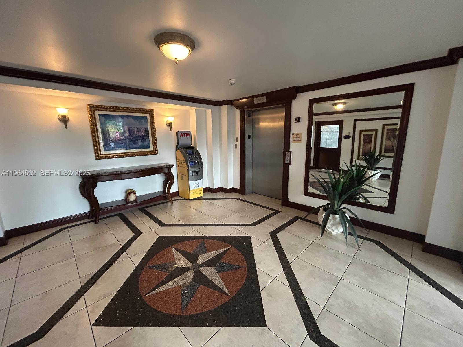 5077 Northwest 7th Street, Unit 1012 Miami, FL 33126 - Photo 3 of 15 a living room with furniture and floor to ceiling window