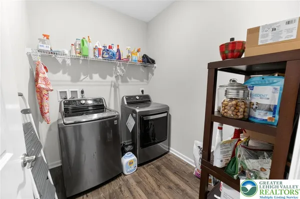 a kitchen with stainless steel appliances granite countertop a refrigerator and a stove
