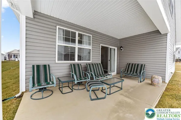 a view of balcony with two chairs and couches