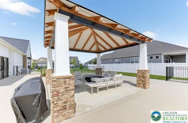 a view of pool with patio