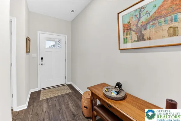 a room with furniture and wooden floor