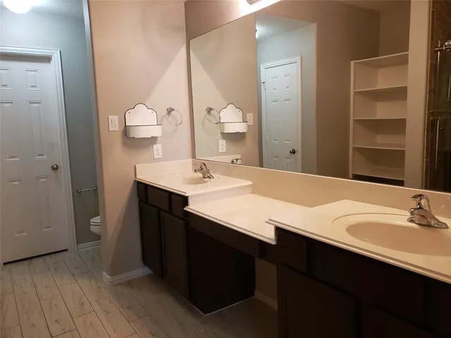 a bathroom with a toilet and a sink