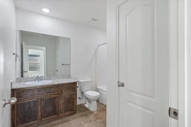 a bathroom with a sink toilet a mirror and shower