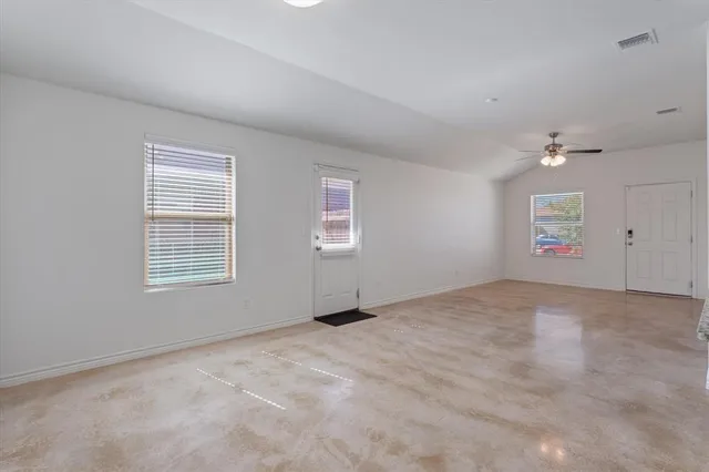 a view of an empty room with a window