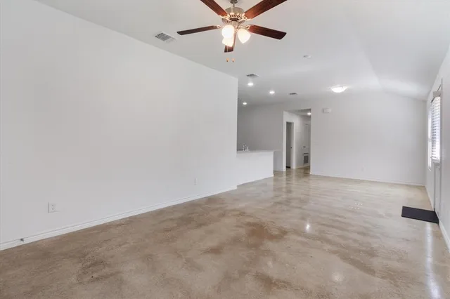 a spacious bathroom with a double vanity sink and a mirror