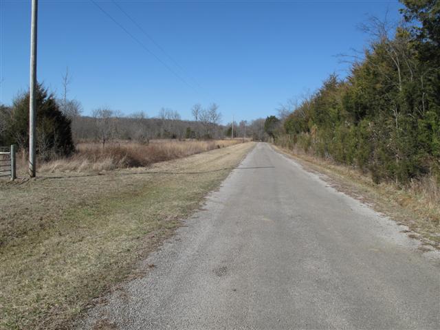 0 Tuckaway Road Eagleville, TN 37060 - Photo 1 of 8 PROPERTY LINE STARTS AT UTILITY POLE ,VIEWING TO THE NORTH, ROAD CURVES TO LEFT