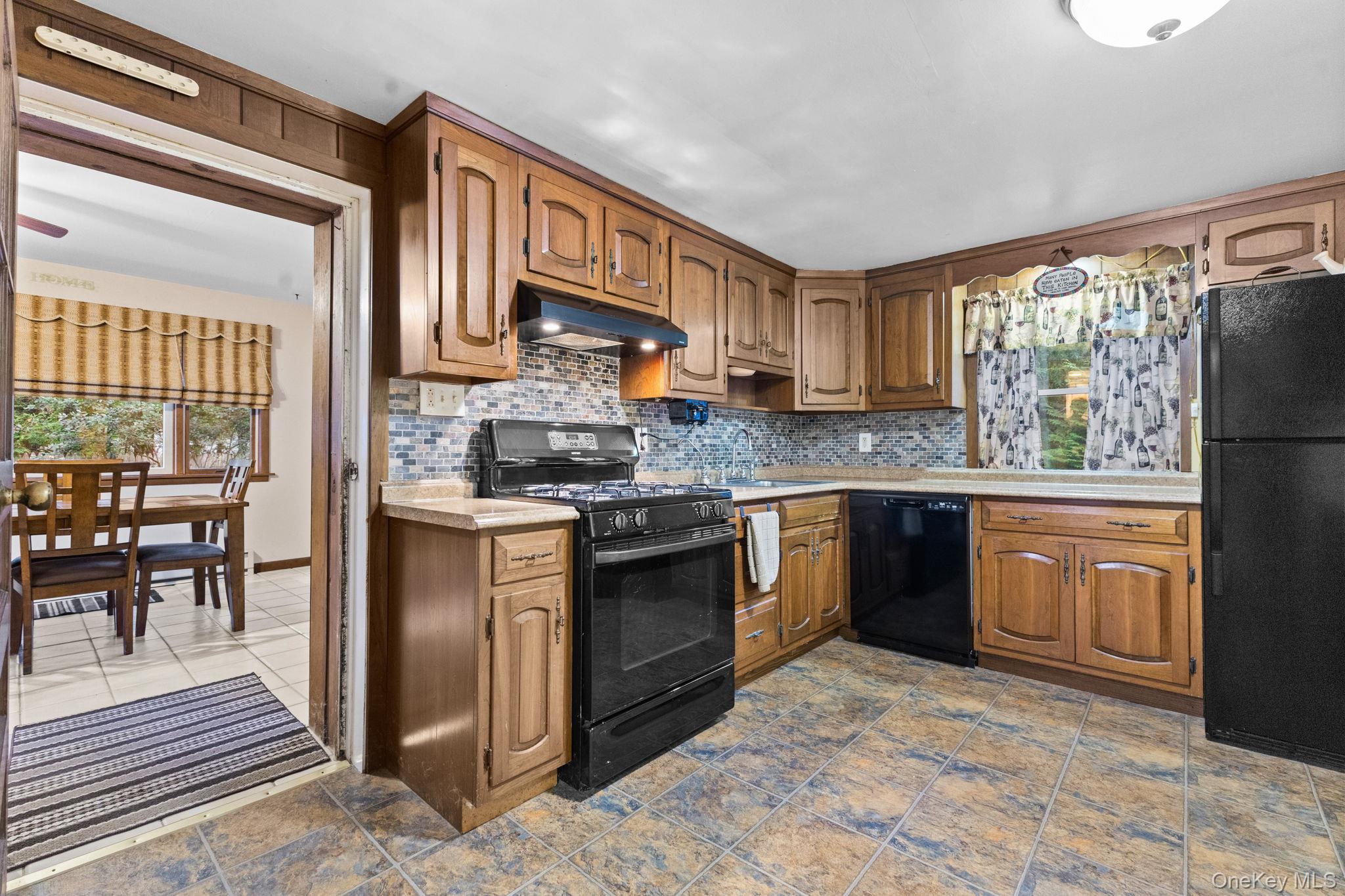 11 Orleans Road Patterson, NY 12563 - Photo 12 of 23 Lower level kitchen opens to sunroom
