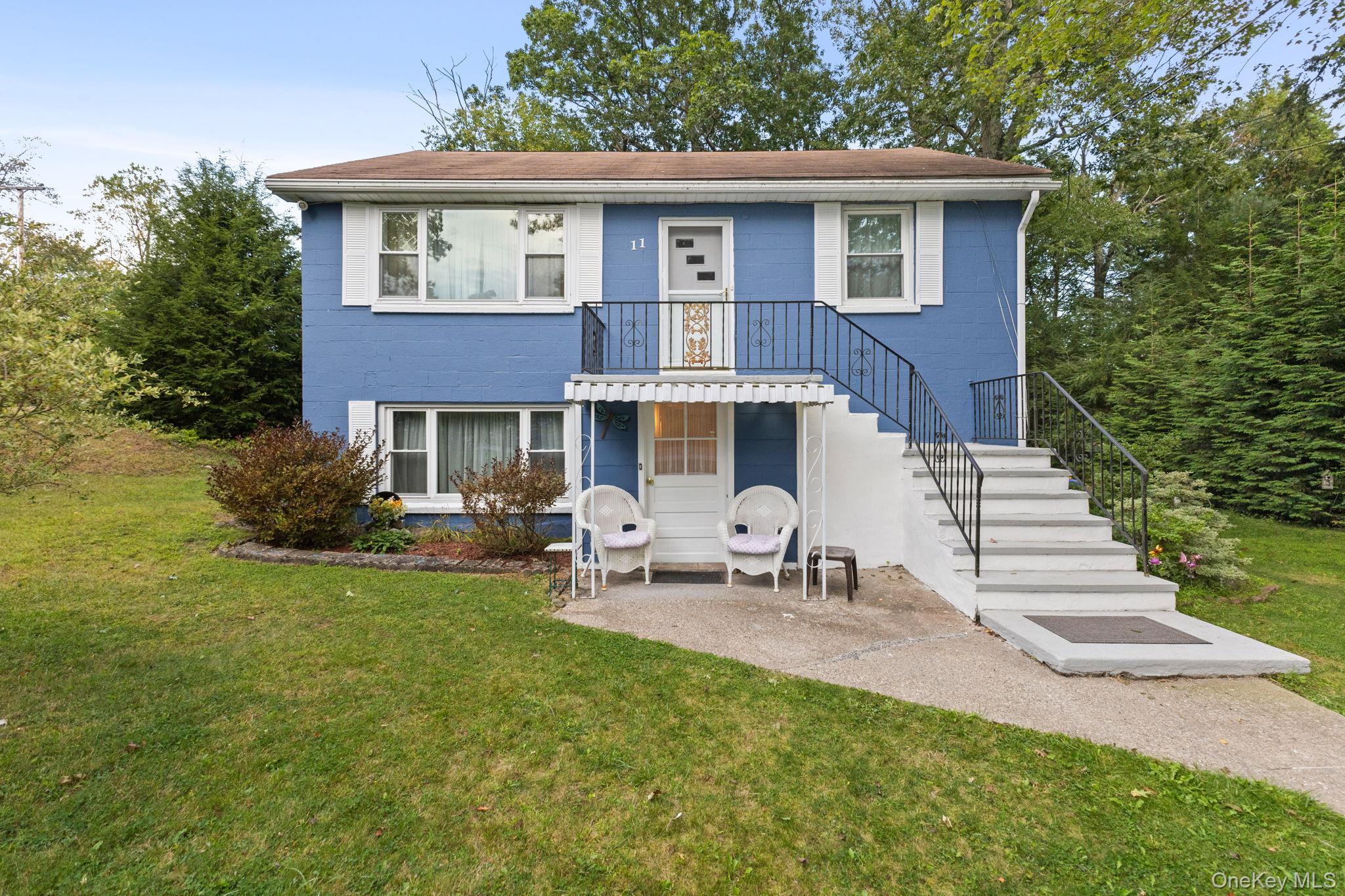 11 Orleans Road Patterson, NY 12563 - Photo 14 of 23 View of front of house featuring a front lawn, a patio area.