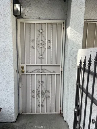 a view of a door with wooden floor