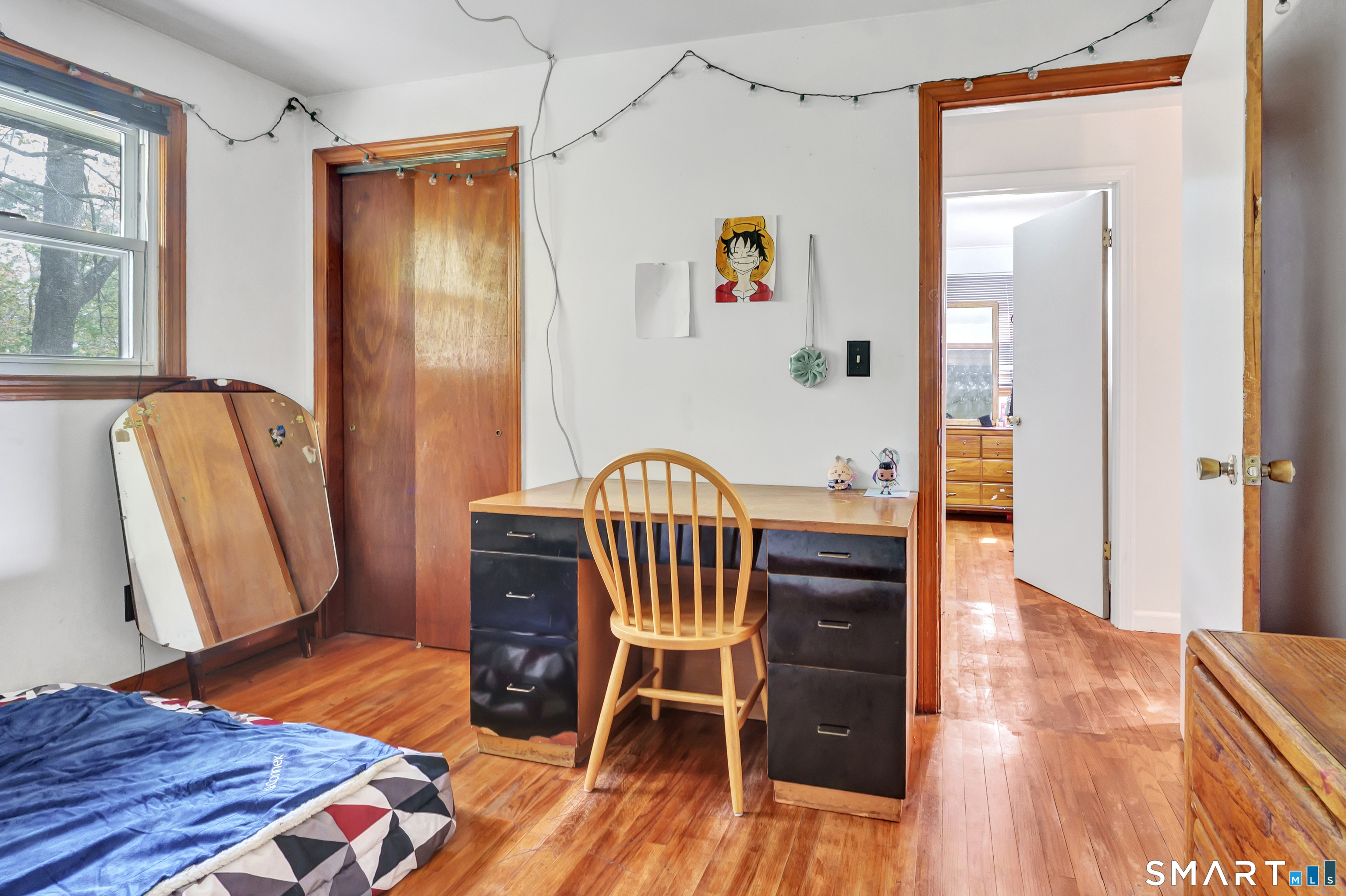 136 Harrison Drive Hamden, CT 06514 - Photo 12 of 20 a view of a bedroom with furniture and wooden floor