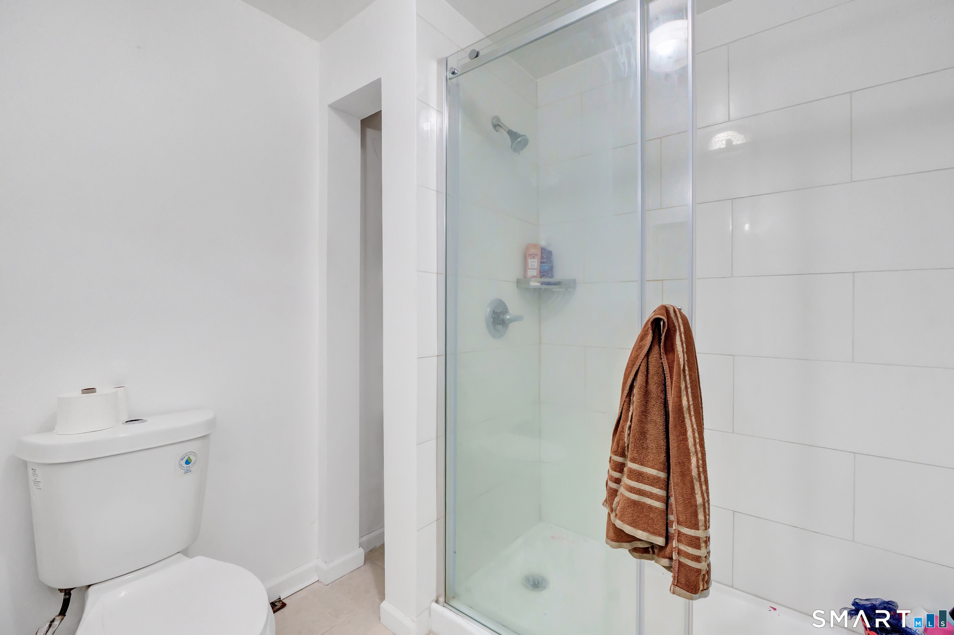 136 Harrison Drive Hamden, CT 06514 - Photo 15 of 20 a bathroom with a shower a toilet and a sink