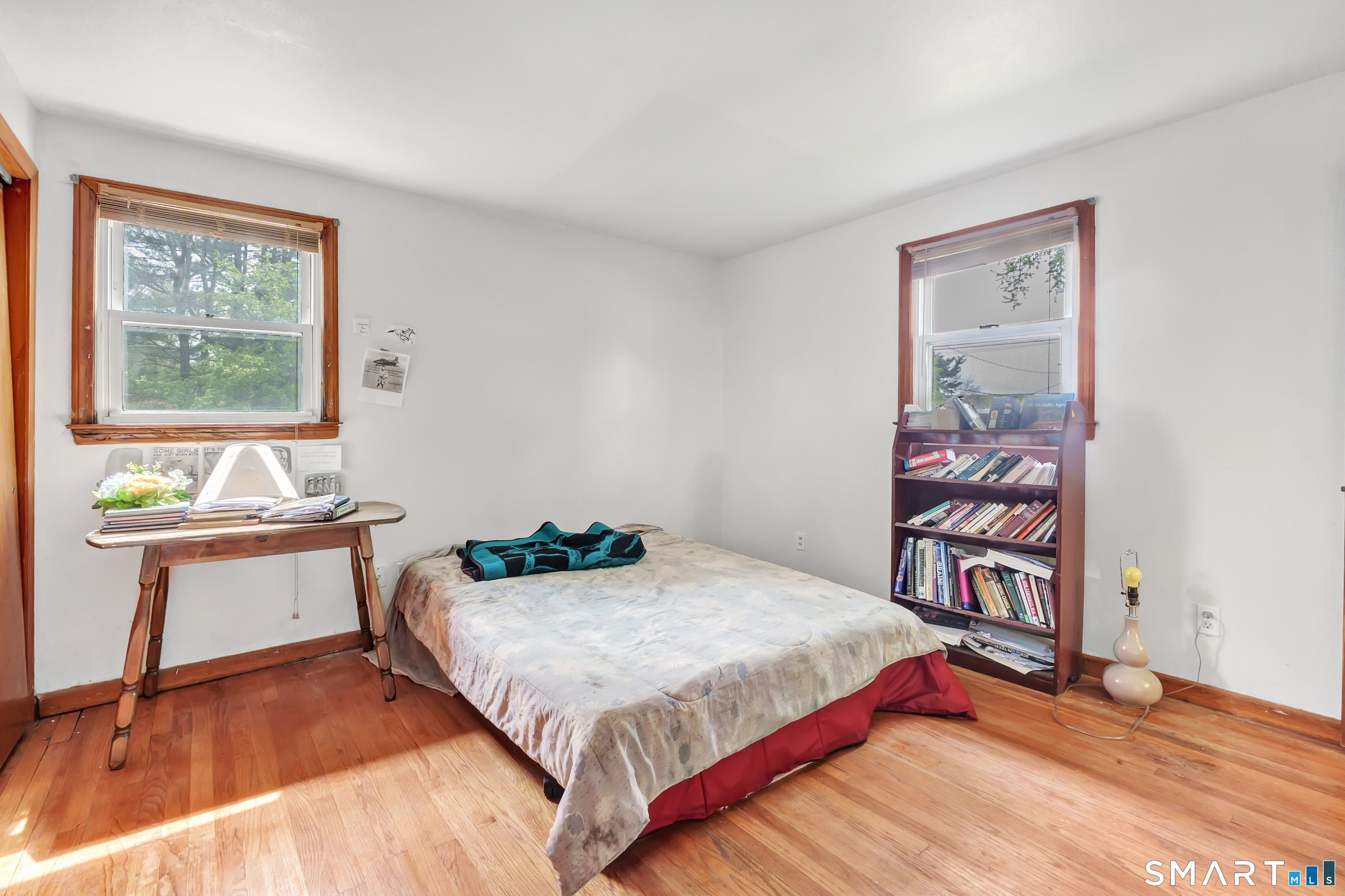 136 Harrison Drive Hamden, CT 06514 - Photo 16 of 20 a bedroom with a bed and a table in it