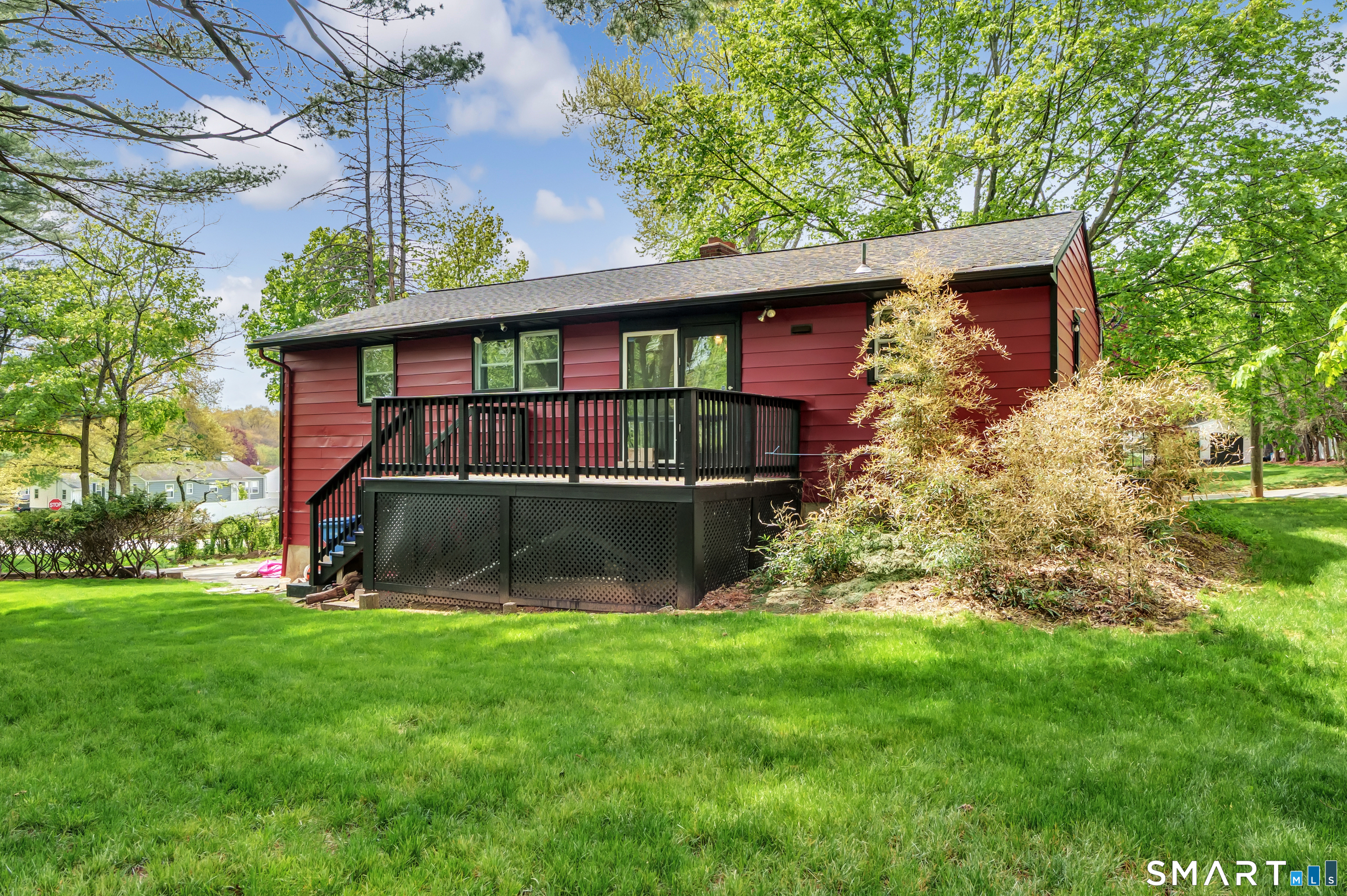136 Harrison Drive Hamden, CT 06514 - Photo 3 of 20 a view of a house with a yard