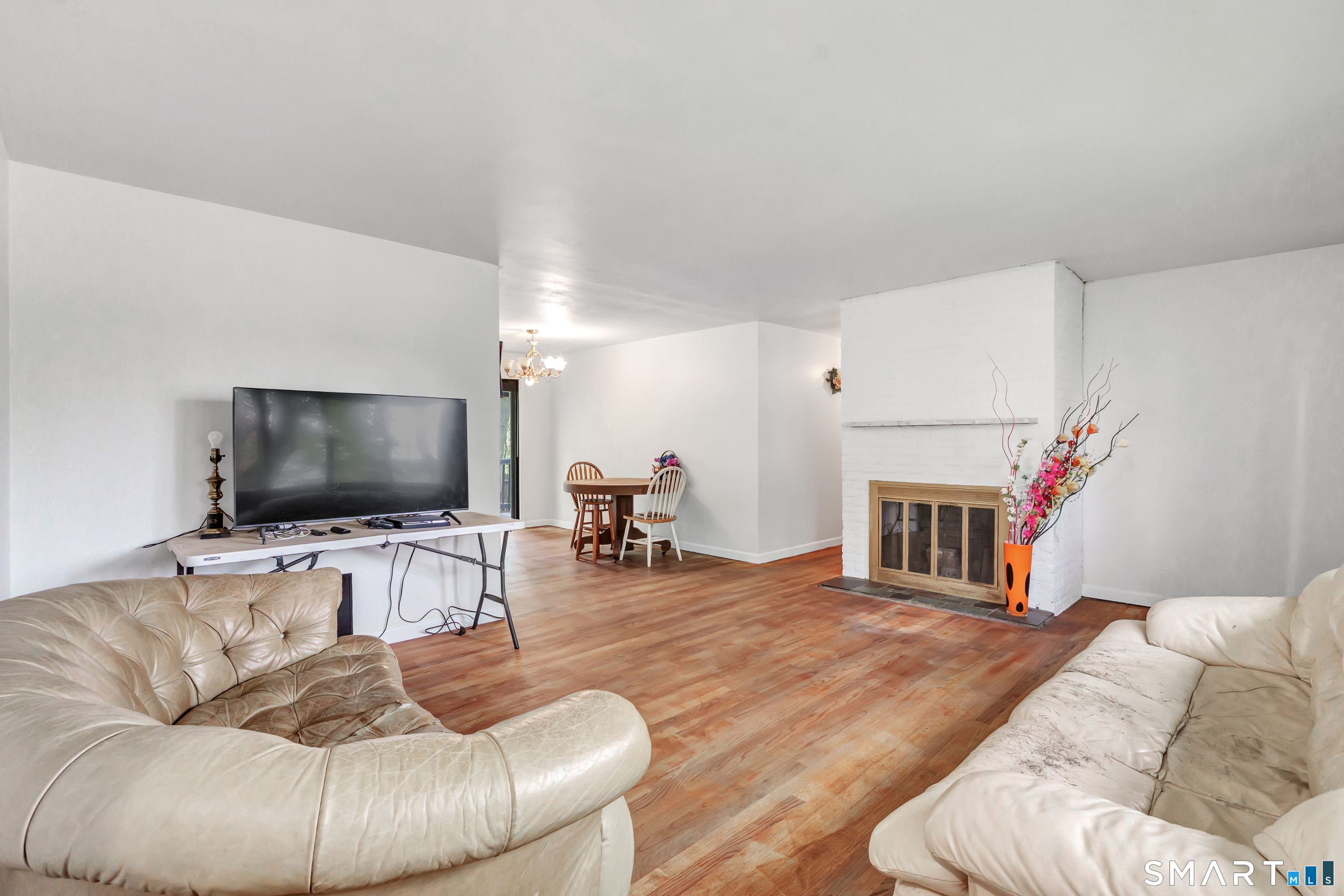 136 Harrison Drive Hamden, CT 06514 - Photo 5 of 20 a living room with furniture and a flat screen tv