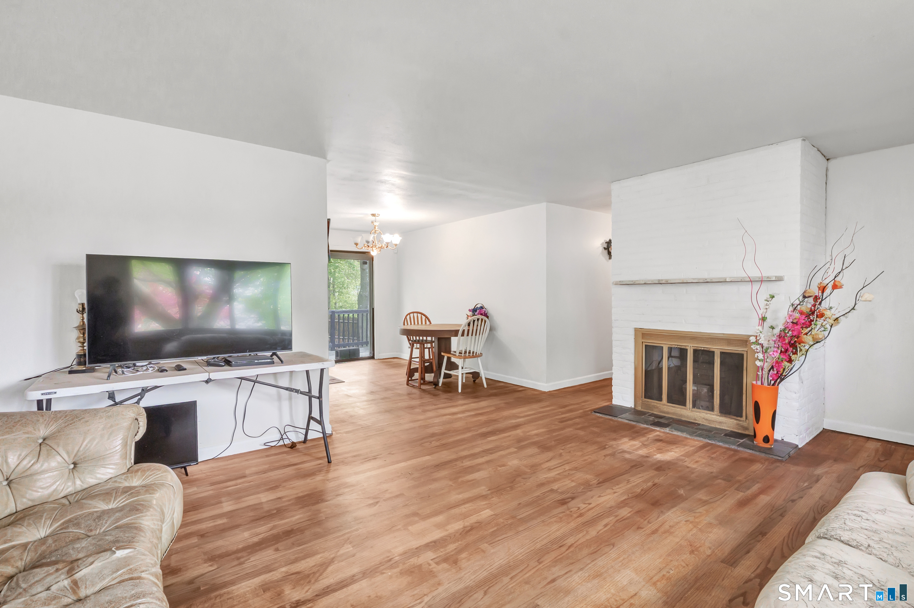 136 Harrison Drive Hamden, CT 06514 - Photo 6 of 20 a living room with furniture and a flat screen tv