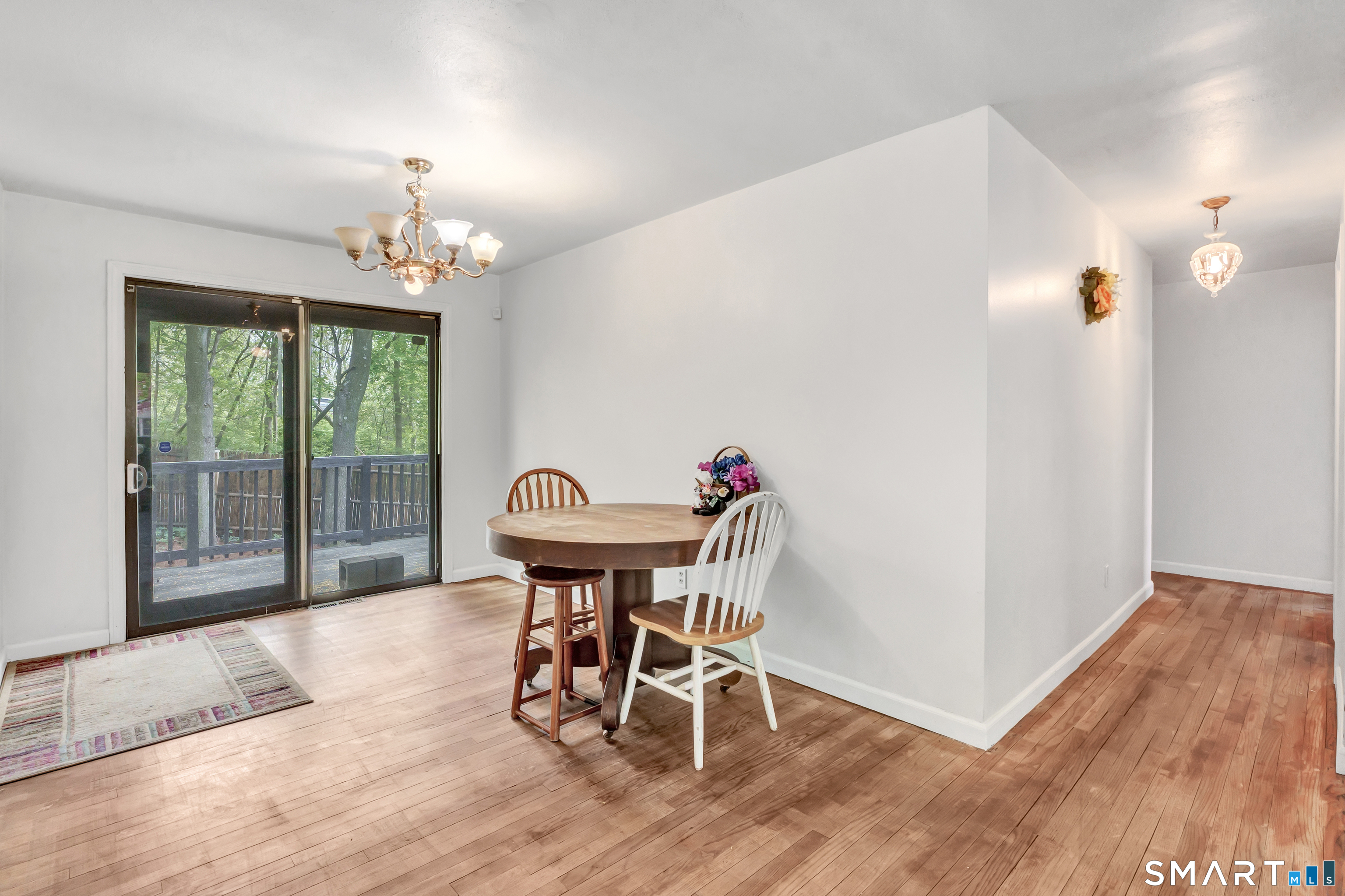 136 Harrison Drive Hamden, CT 06514 - Photo 7 of 20 a view of a dining room with furniture window and wooden floor
