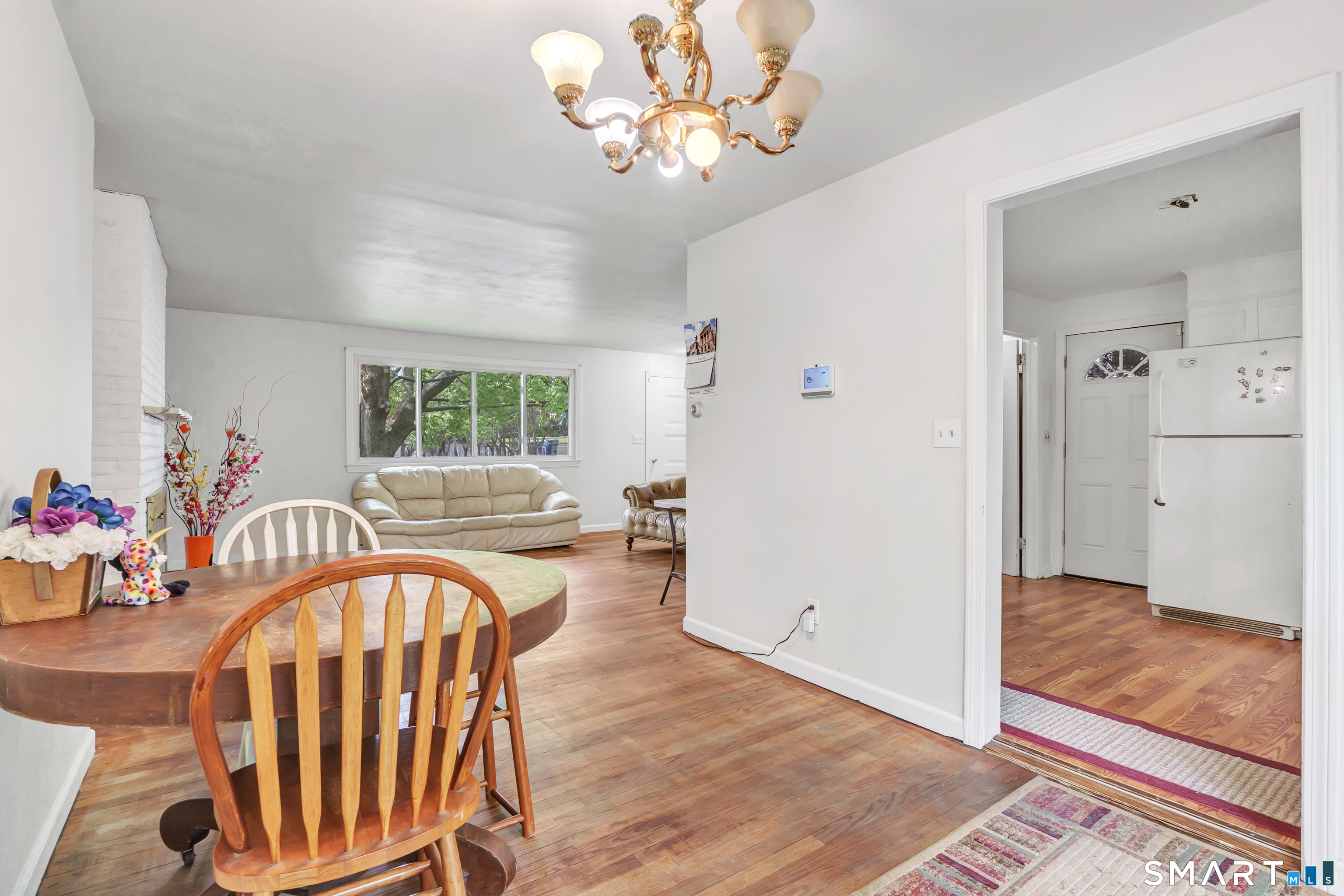 136 Harrison Drive Hamden, CT 06514 - Photo 8 of 20 a view of a livingroom with furniture window and wooden floor