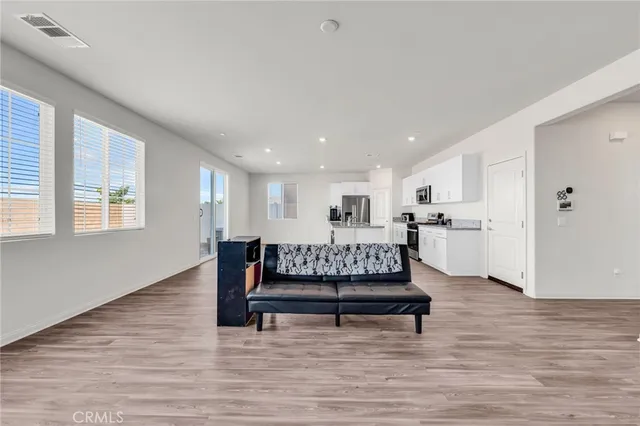 a kitchen with stainless steel appliances granite countertop a sink and cabinets
