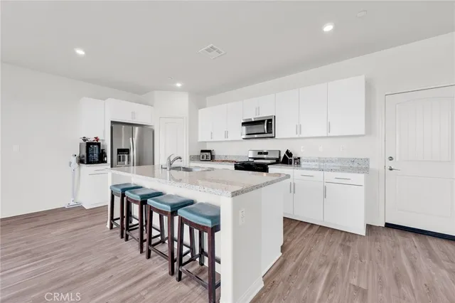 a view of a livingroom with a car parked in it