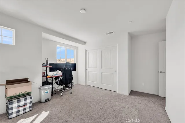 a bedroom with a bed and a fireplace